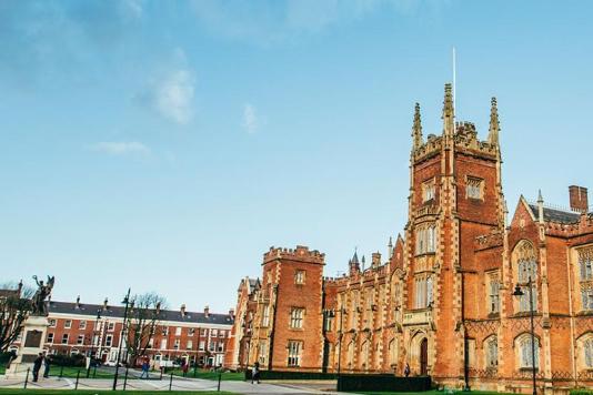 Side angle of front of Lanyon building of QUB in bright sunlight